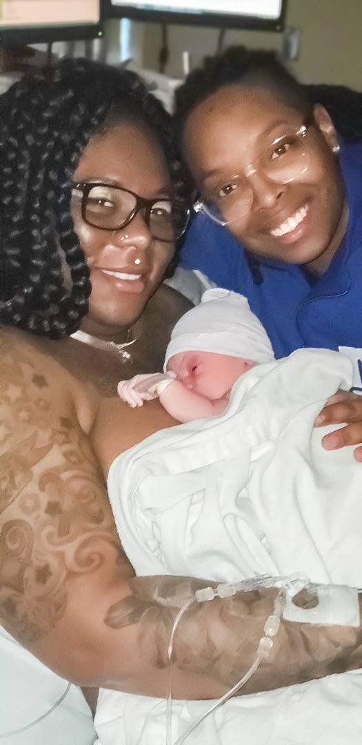 New mamas hold their newborn in hospital bed after birth!
