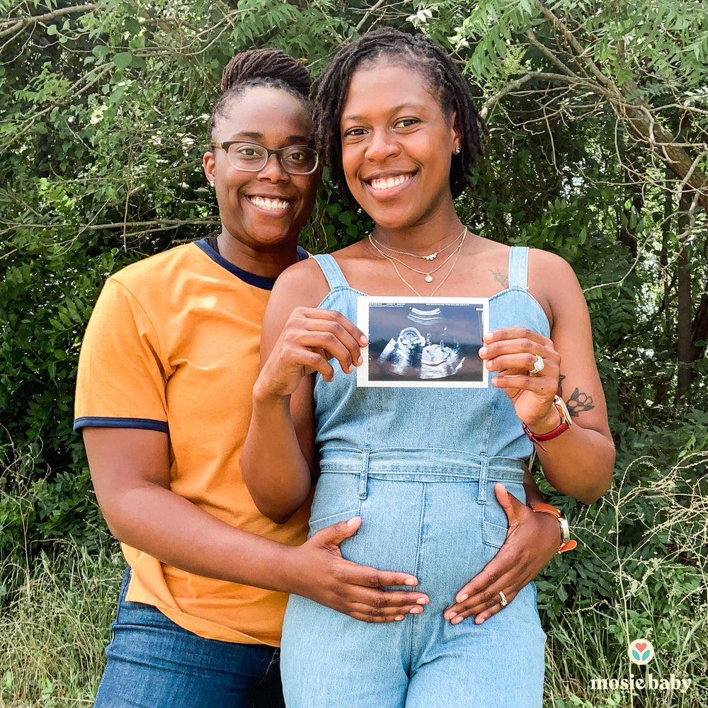 Mosie mamas holding a sonogram
